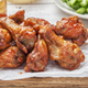 chicken wings on wooden plate